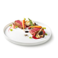 Side view of Alta Cucina 10.5" x 0.75" Opal Glass Medium Stacking Plate (Set of 12)