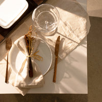 Side view of Alta Cucina 10.5" x 0.75" Opal Glass Medium Stacking Plate (Set of 12)