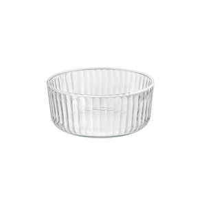 A clear round Exclusiva glass serving bowl with a multifaceted texture.
