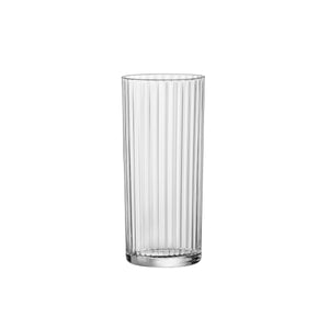 A clear Exclusiva Tom Collins glass with vertical ridges designed for use as a cocktail or water glass.