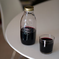 Side view of Quattro Stagioni 33.75 oz. Canning Bottle with Lid (Set of 12)