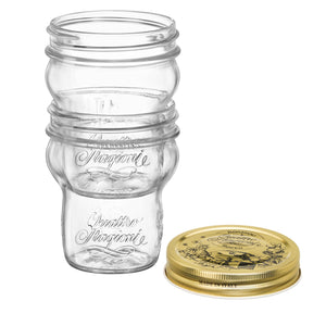 Clear Special Edition Quattro Stagioni glass jar stacked with gold lid on a white background